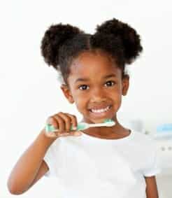 Young Girl Brushing Teeth