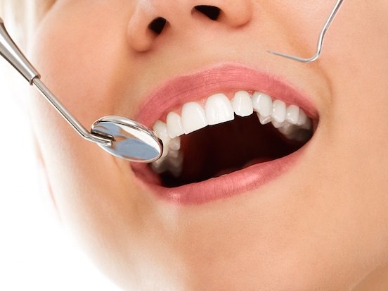Woman getting Dental Exam for her gum health.