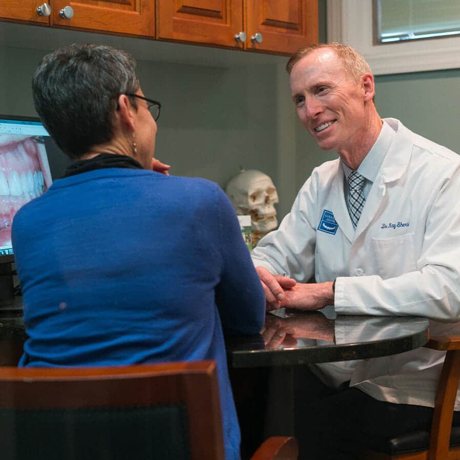 Dr. Sheridan going over images with a patient.