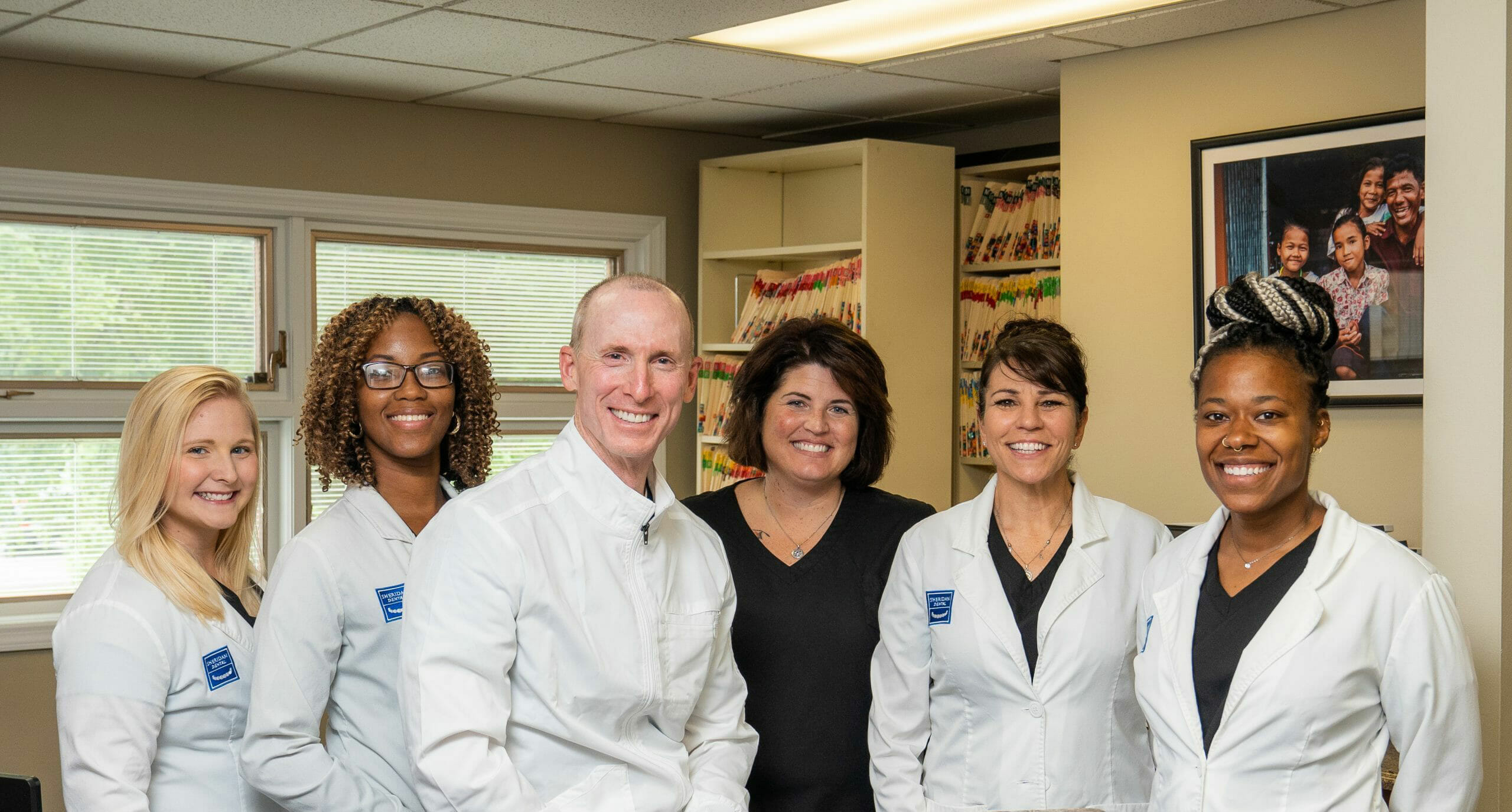 The Sheridan Dental Group team, ready to upgrade smiles.