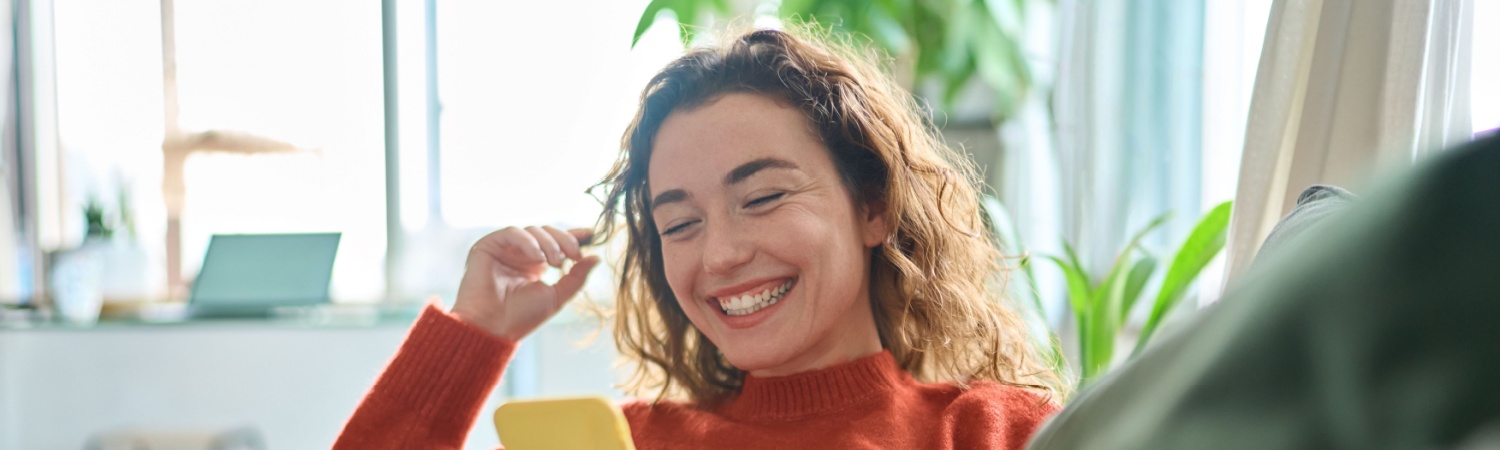 A young woman smiling confidently with whitened teeth in Grove City.